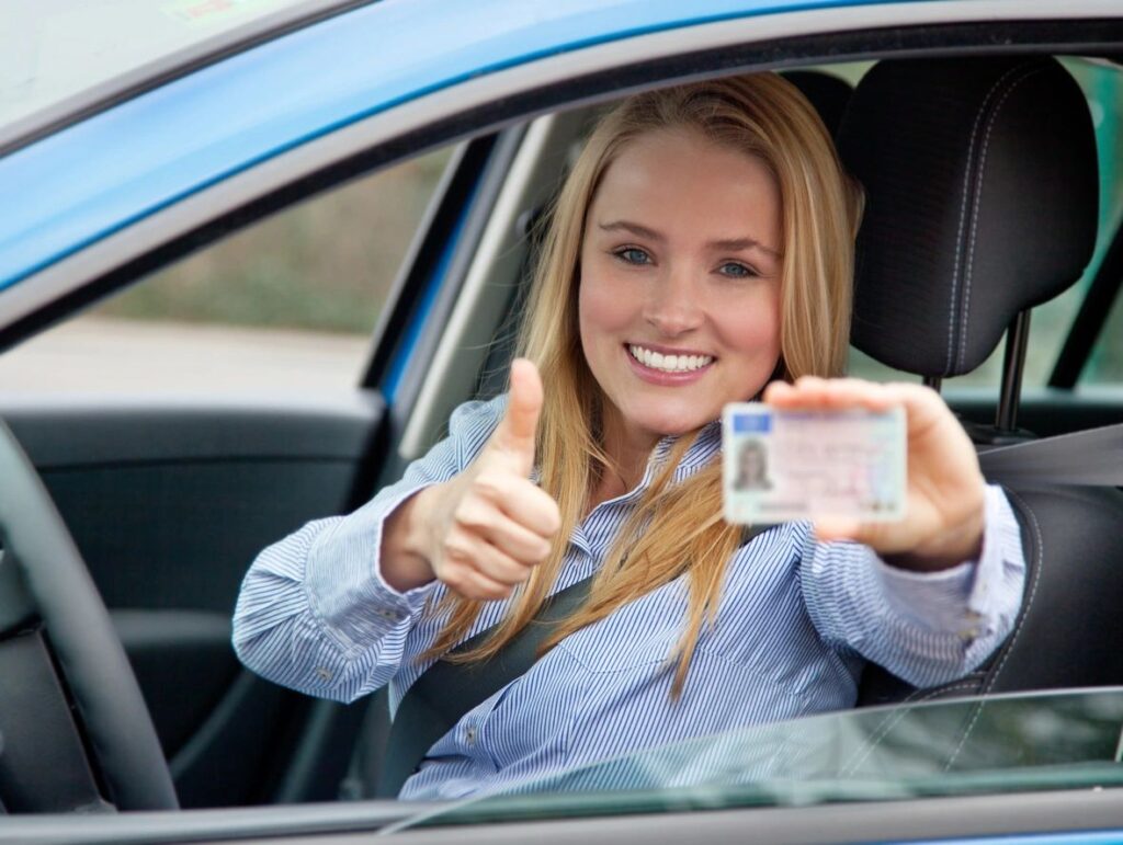 girl showing her driver's license