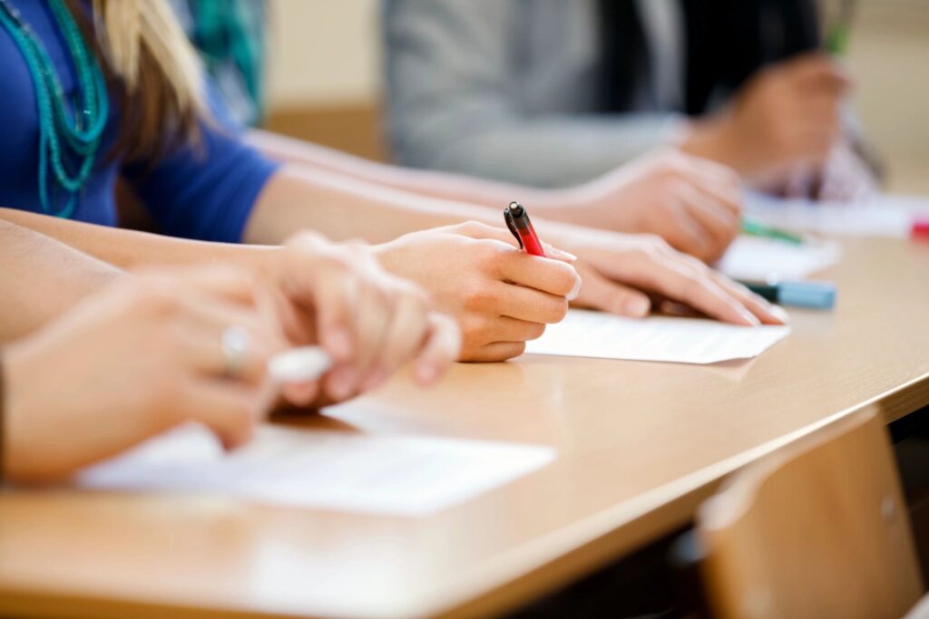 students writing on papers