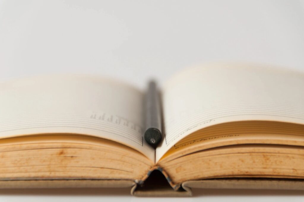 a book with a pen in the middle