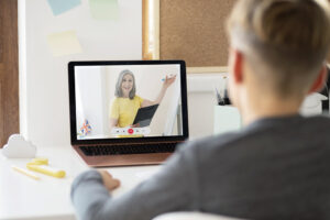 A lady teaching online using online learning platforms