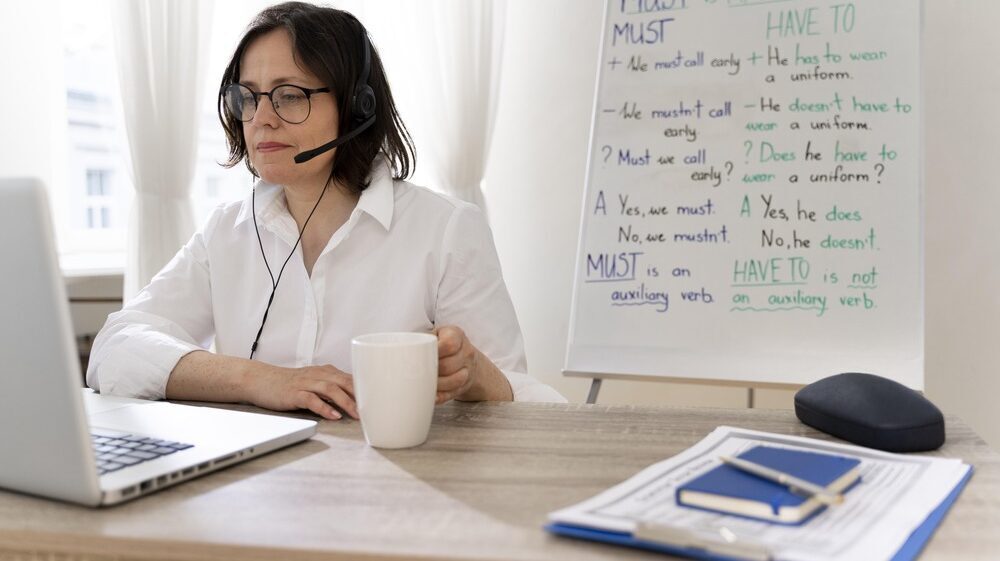 English teacher doing her lessons online at home