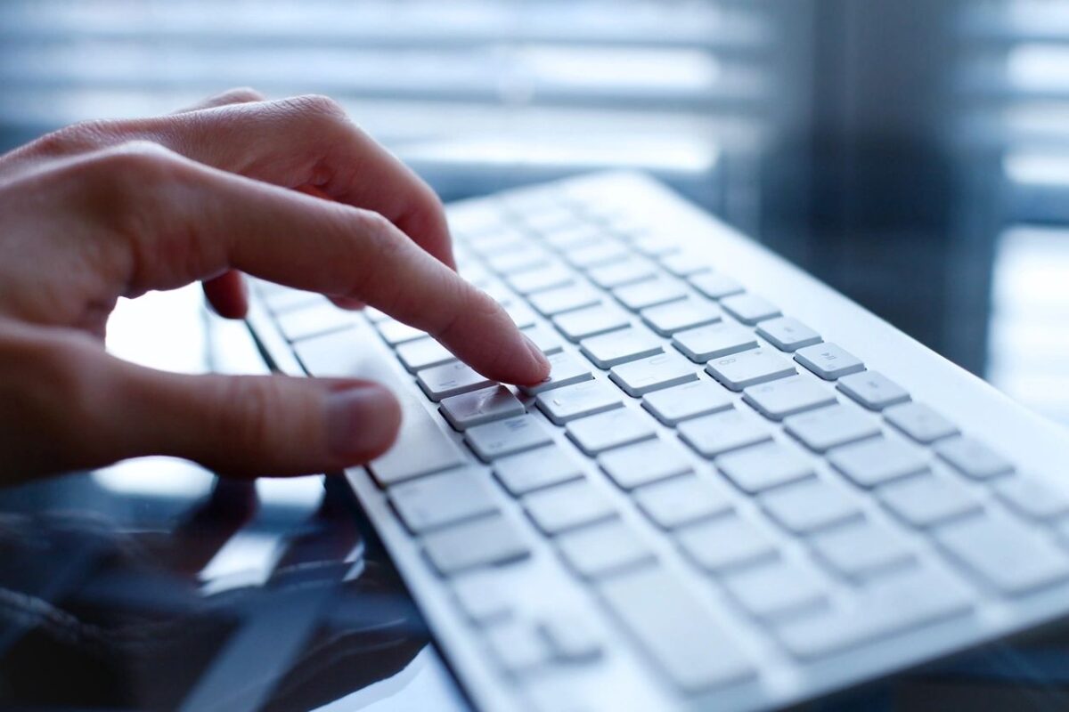 image of hang typing on computer
