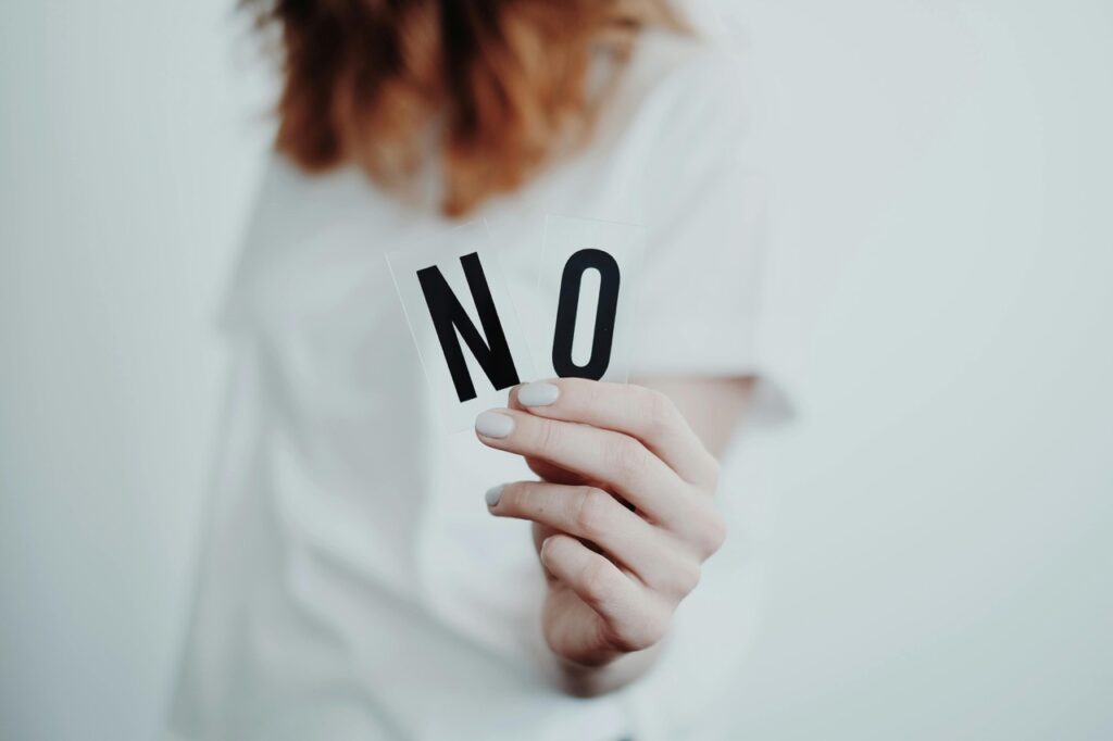 girl holding no sign in her hand