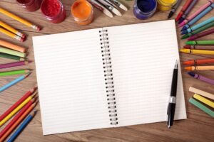 picture of a book with crayons around it