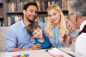 a family talking with a guy